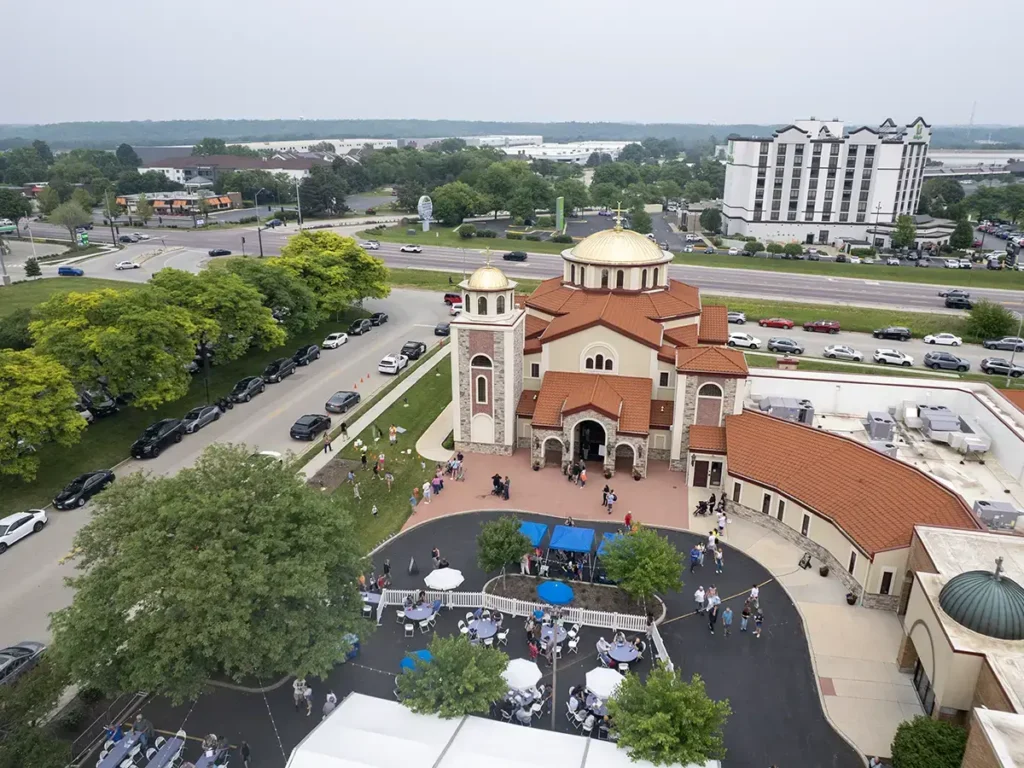 Drone image showcasing the architecture of Saint Sophia Greek Orthodox Church with the festival tents in the background.