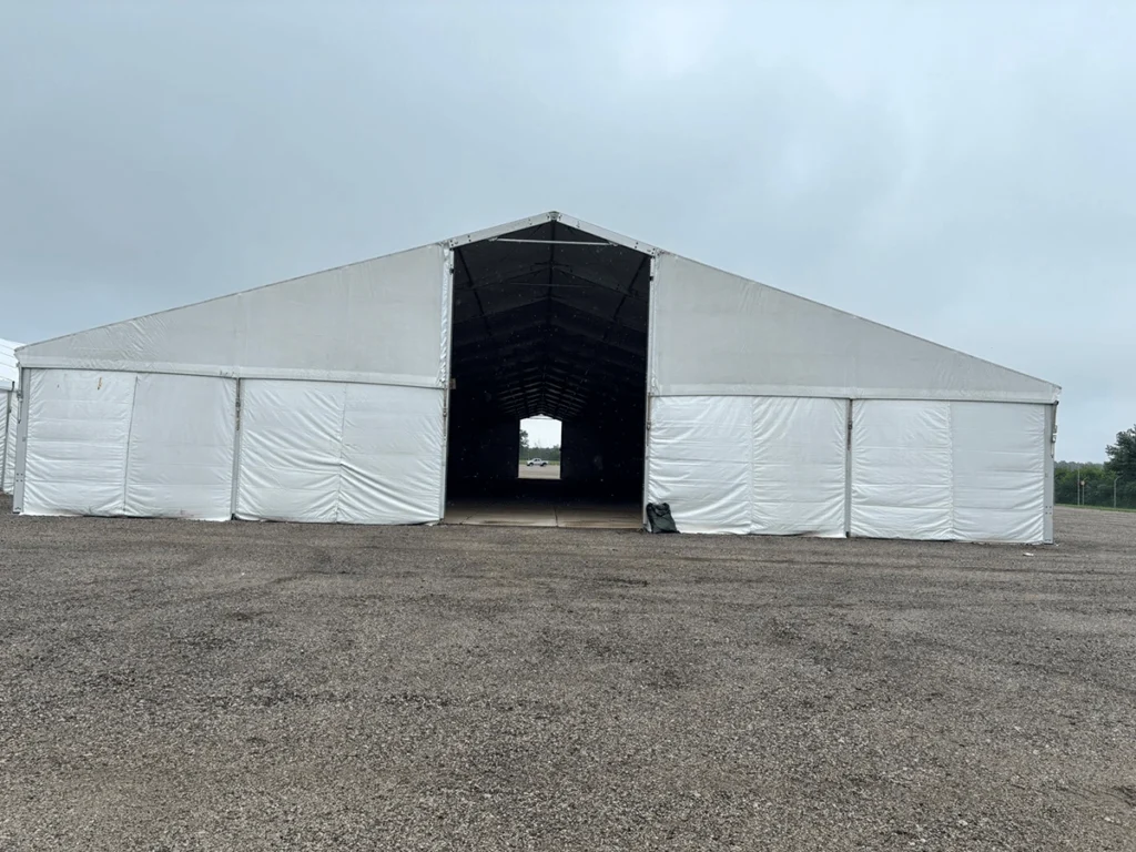 Straight-on view of a clearspan structure with a large open entryway and sidewalls.