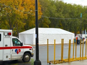 A medical tent stands ready near the race route with fall foliage in the background, part of the infrastructure JK Rentals provided for Hot Chocolate Chicago.